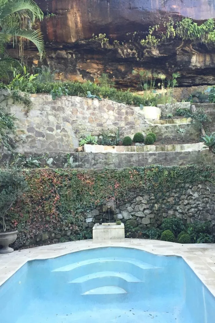 Pool Beneath the Sandstone Cliff